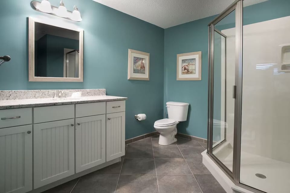 Start your day with a bright vanity and roomy shower.