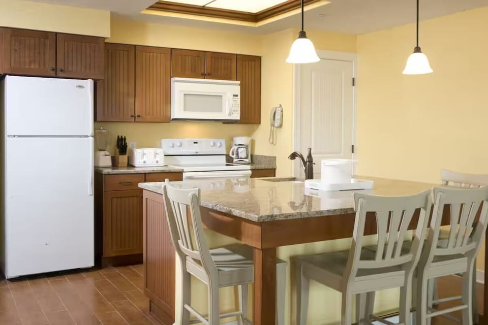 Cook vacation meals easily in a bright, full kitchen.