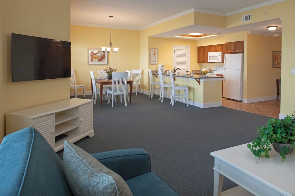 Unwind in a bright open-plan suite with easy lounging.