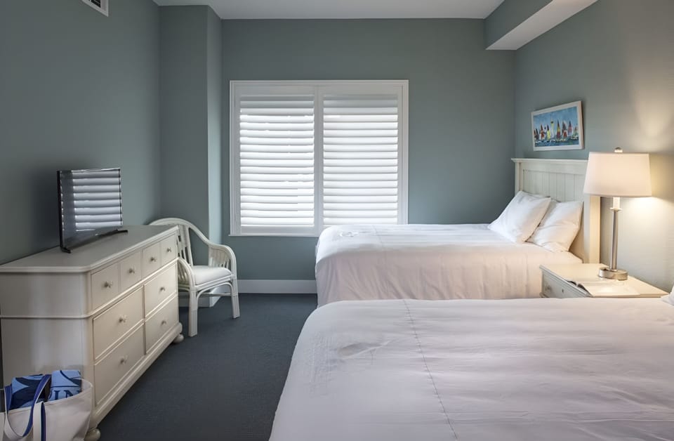 Stretch out in a bright bedroom with comfortable double beds.