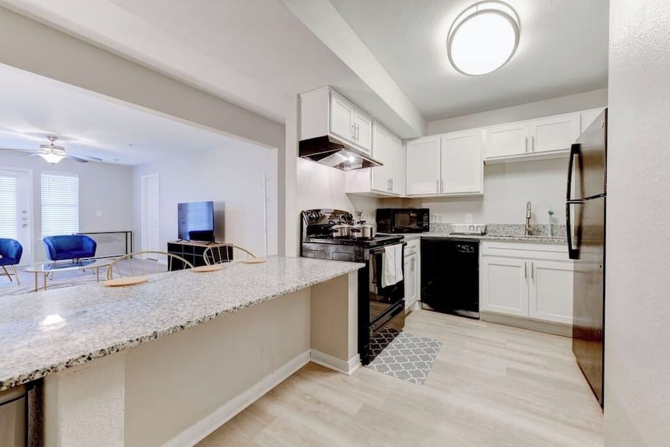 Modern kitchen w/ breakfast bar and sleek finishes