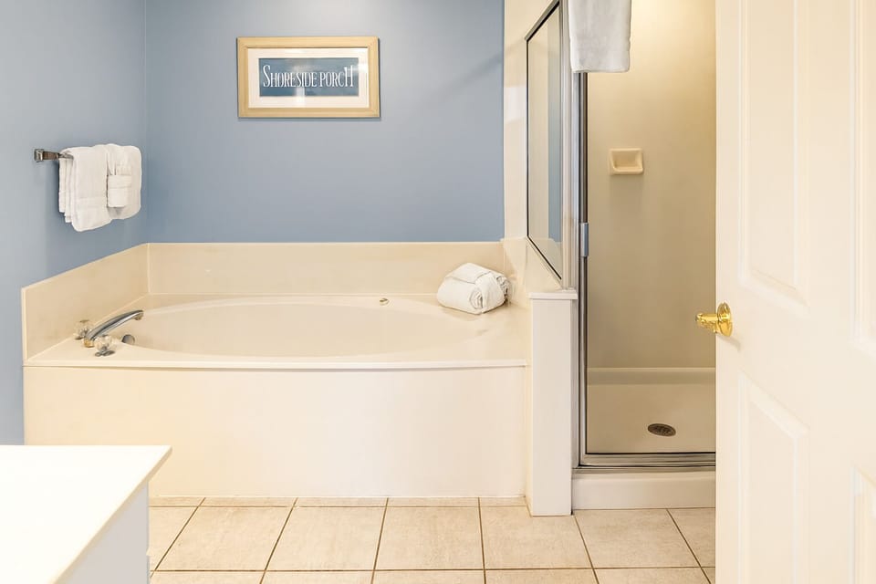 Soak and recharge in the deep tub beside walk-in shower.