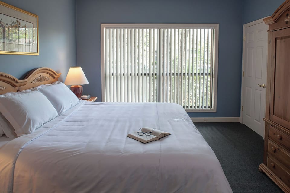 Wake gently to daylight filtering through wide bedroom windows.