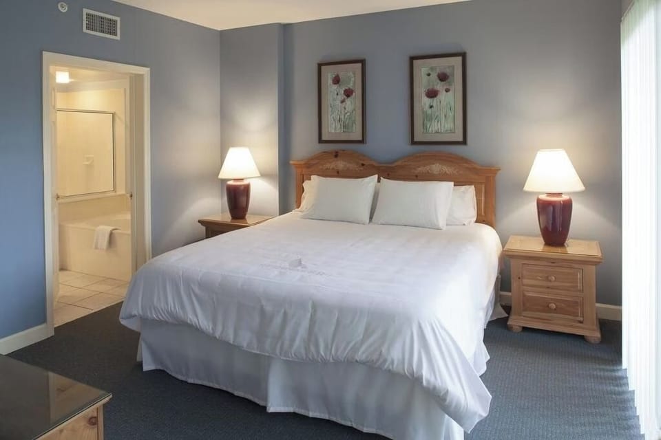 Unwind in crisp linens with convenient en-suite access.