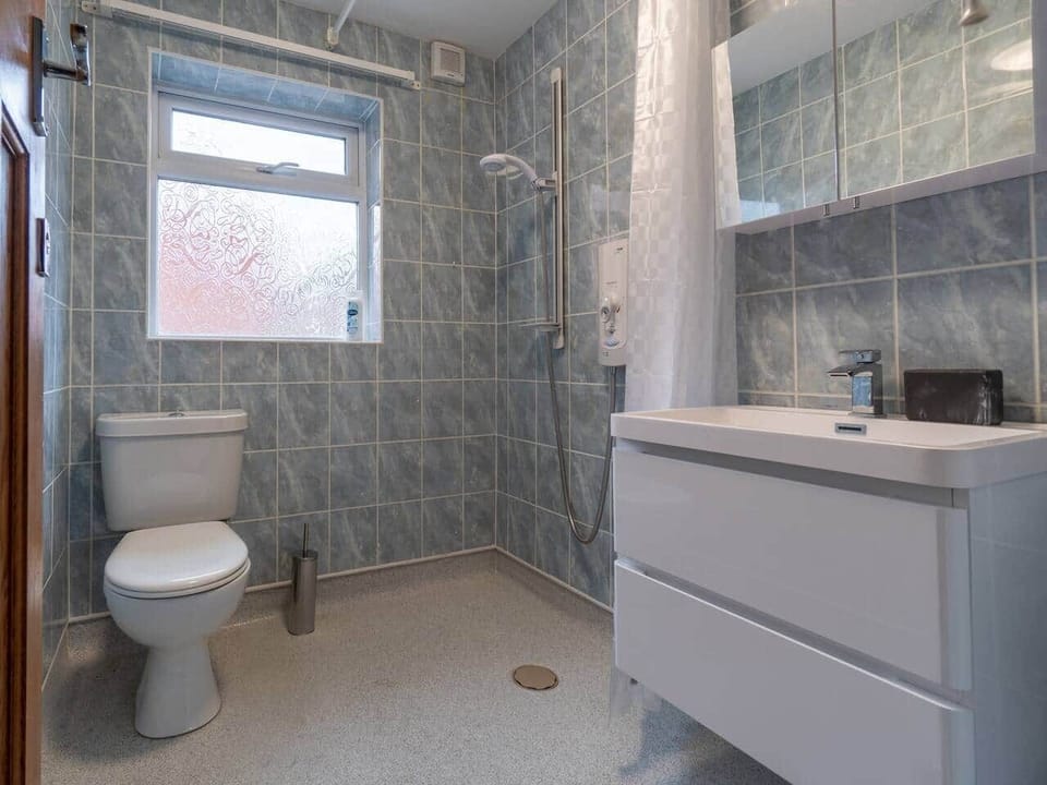 Easy access ample sized wetroom with complementary toiletries and thermostatically controlled electric shower
