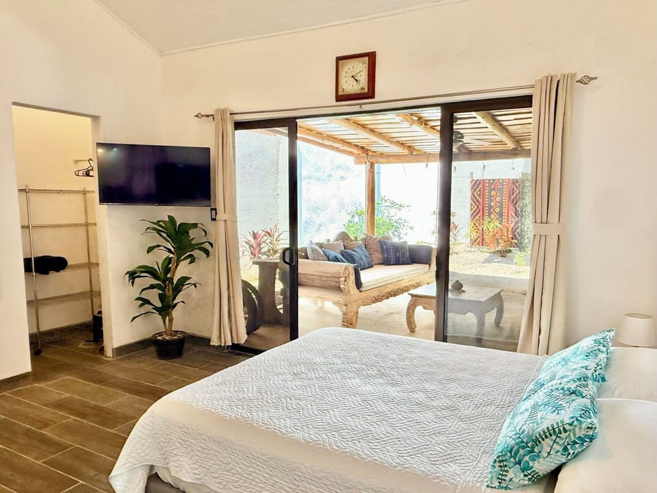 Queen Bed, Patio and Garden View | View from room