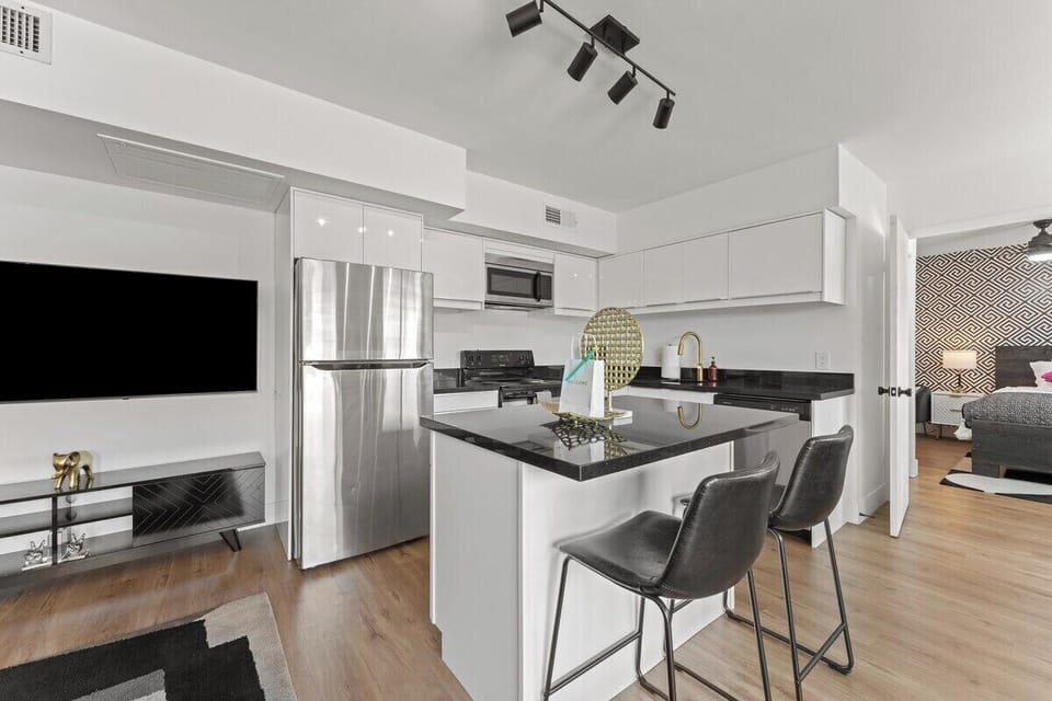 Enjoy the convenience of top-notch appliances, ample counter space, and a cozy dining area for shared culinary experiences.