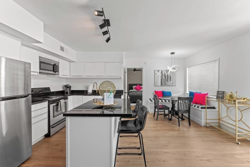 Enjoy the convenience of top-notch appliances, ample counter space, and a cozy dining area for shared culinary experiences.