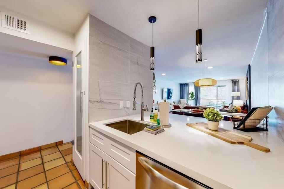 Fully Equipped Kitchen with Stainless Steel Appliances, sleek floating shelves