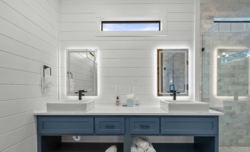 Bathroom 1 with dual sinks and modern finishes.