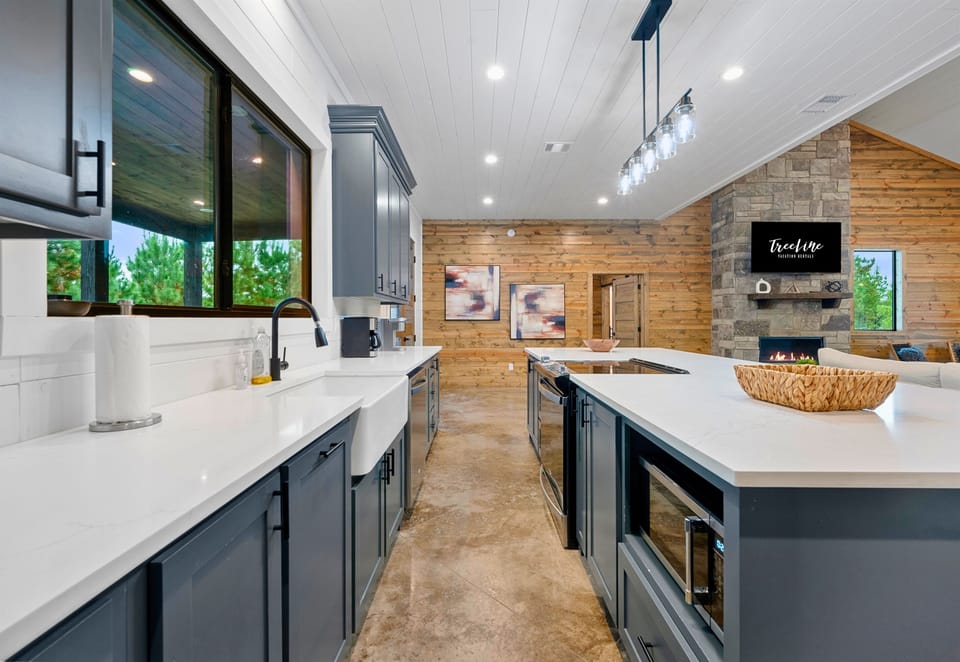 Bright, modern kitchen fully stocked for meals and entertaining.