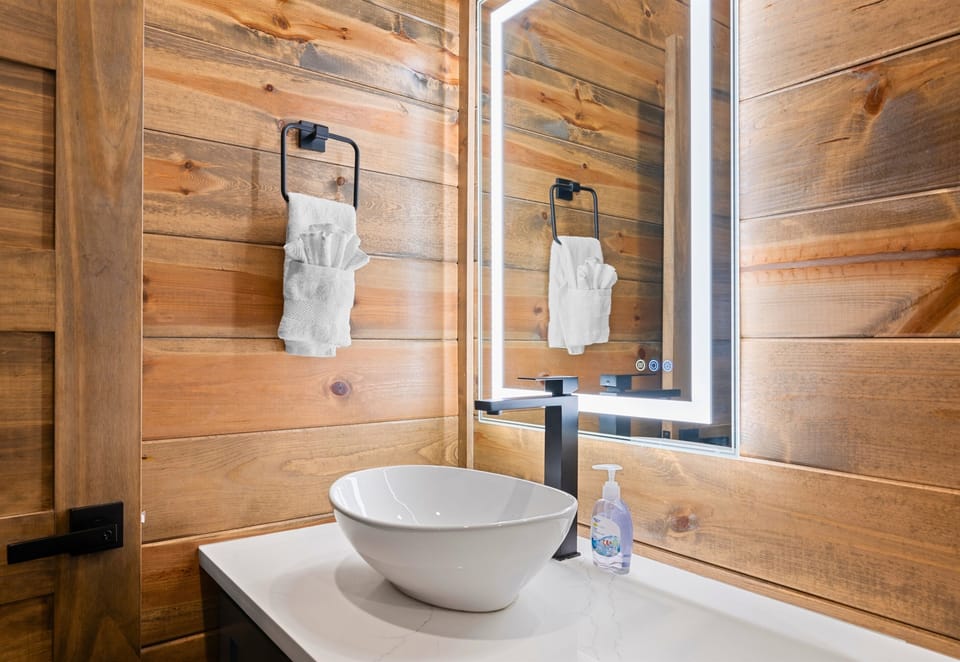 Rustic touches meet modern design in this stylish half bath.