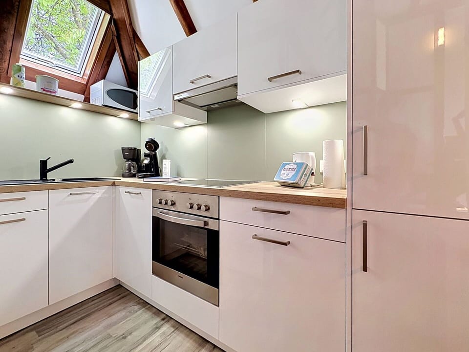 Kitchen Appliance, Kitchen, Interior Design, Countertop, Wood, Flooring, Major Appliance, Furniture, Ceiling, Cabinetry