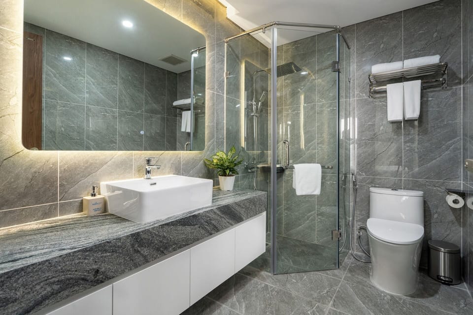 Signature Studio Suite, 3 Bedrooms | Bathroom | Hair dryer, slippers, towels, soap