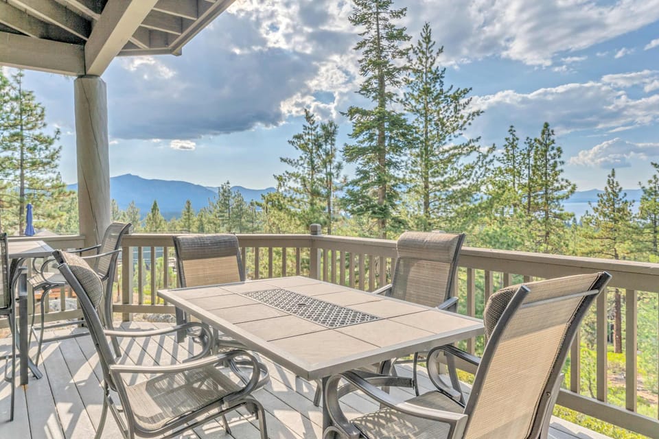 Deck (main floor): Spacious deck with outdoor dining and grill
