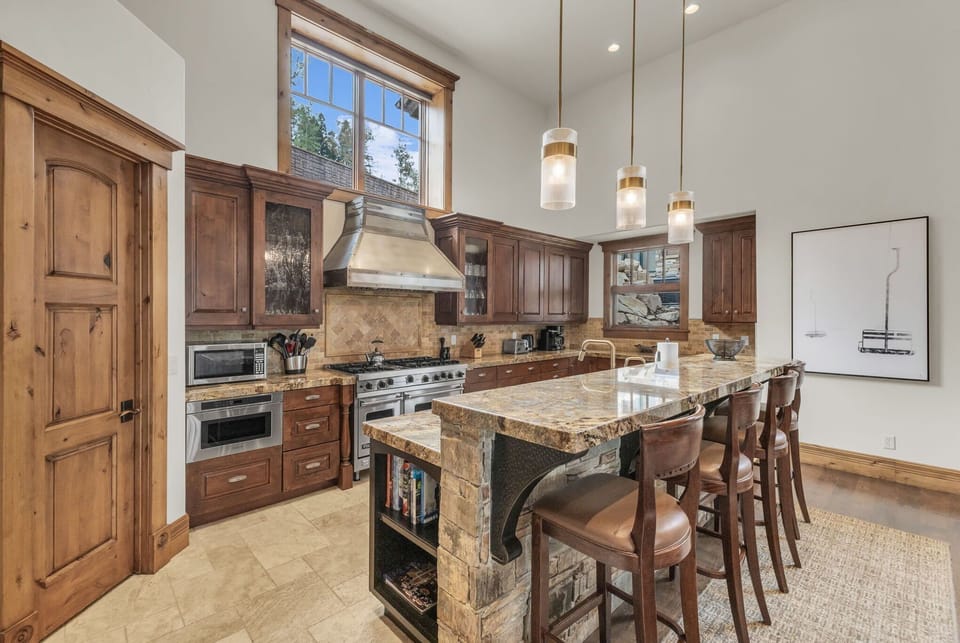 Kitchen: Main floor, Viking range, drip coffee maker, Keurig, toaster, utensils, tableware