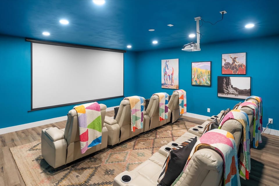 Lights, Camera, Vacation! Who needs a red carpet when you have this incredible theater room all to yourselves? Our vibrant blue cinema is designed for blockbuster entertainment, offering cozy seating and a massive screen for an immersive experience!