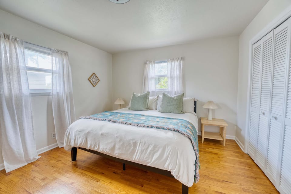 Dreamy bedroom vibes await! 🌙✨ Enjoy comfort and style with our spacious rental, featuring a cozy bed and inviting window views