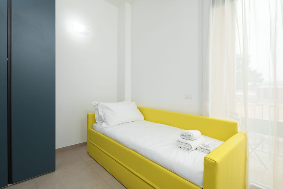 Family Quadruple Room, Balcony | Minibar, in-room safe, desk, blackout drapes
