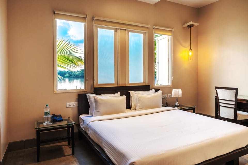 Premium Cottage, 1 Queen Bed, Balcony, River View | Premium bedding, down comforters, desk, laptop workspace