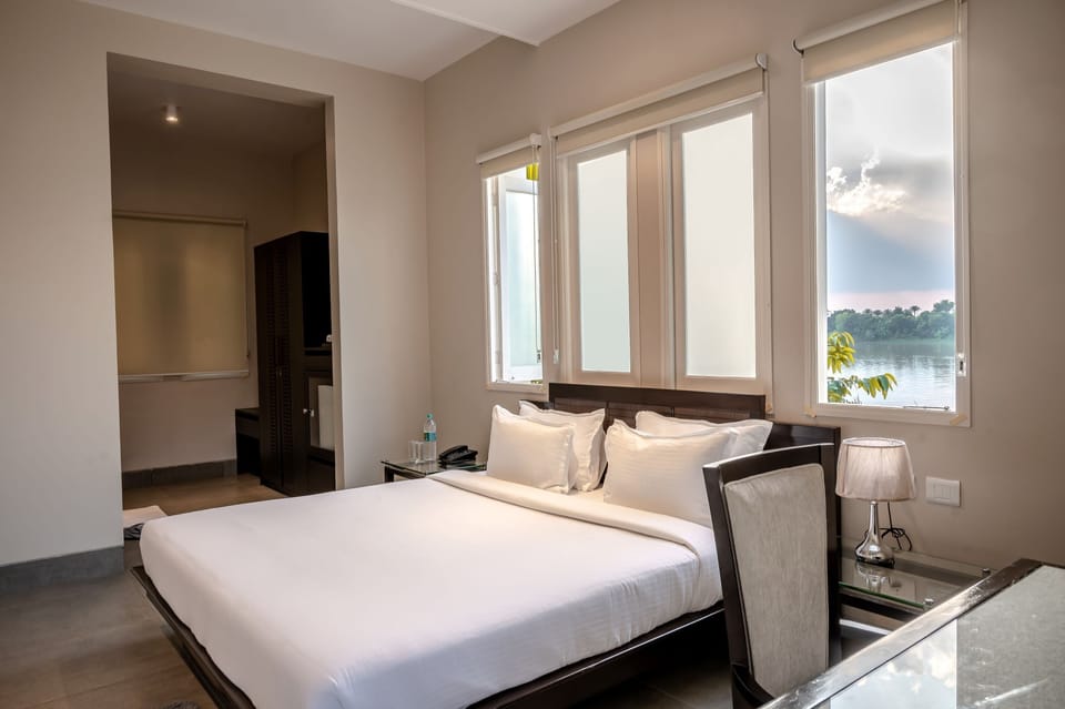 Premium Cottage, 1 Queen Bed, Balcony, River View | Premium bedding, down comforters, desk, laptop workspace