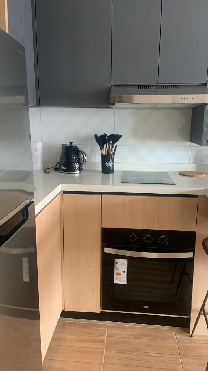 Sleek and modern kitchen with all essentials for a comfortable stay.