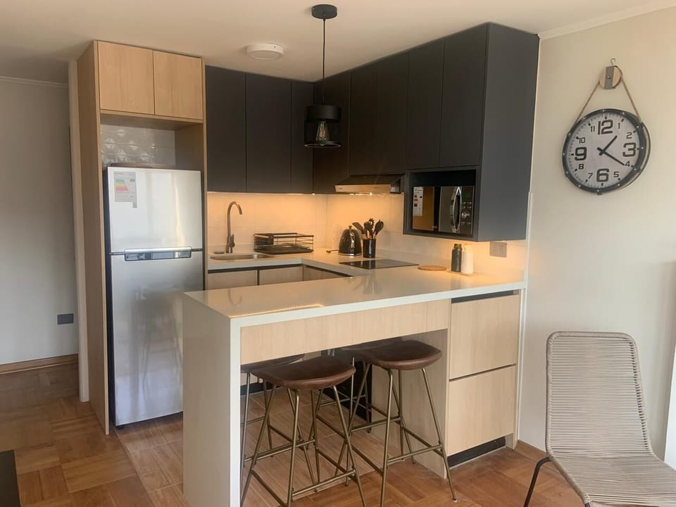Sleek and modern kitchen with stylish finishes, perfect for cooking and dining.