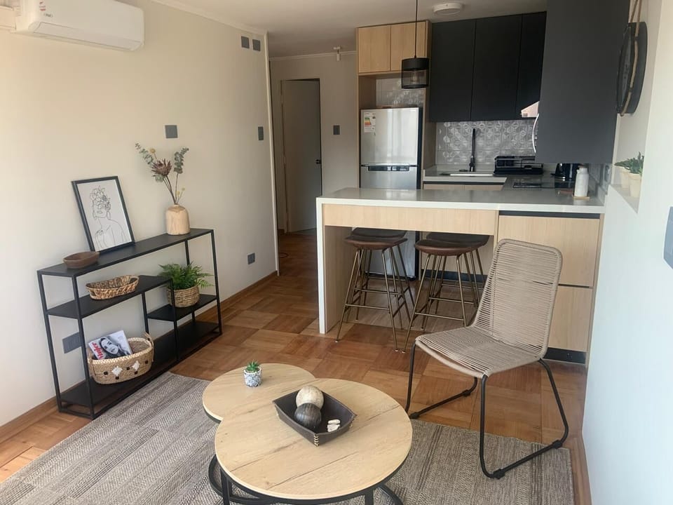 Cozy living area with modern kitchen and stylish decor, perfect for relaxing after exploring the city.