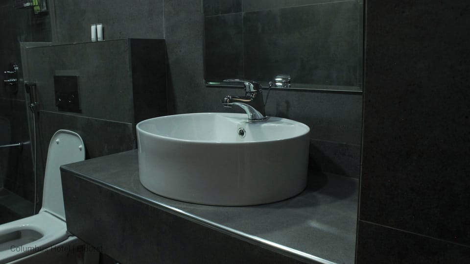 Shower, slippers, bidet, towels