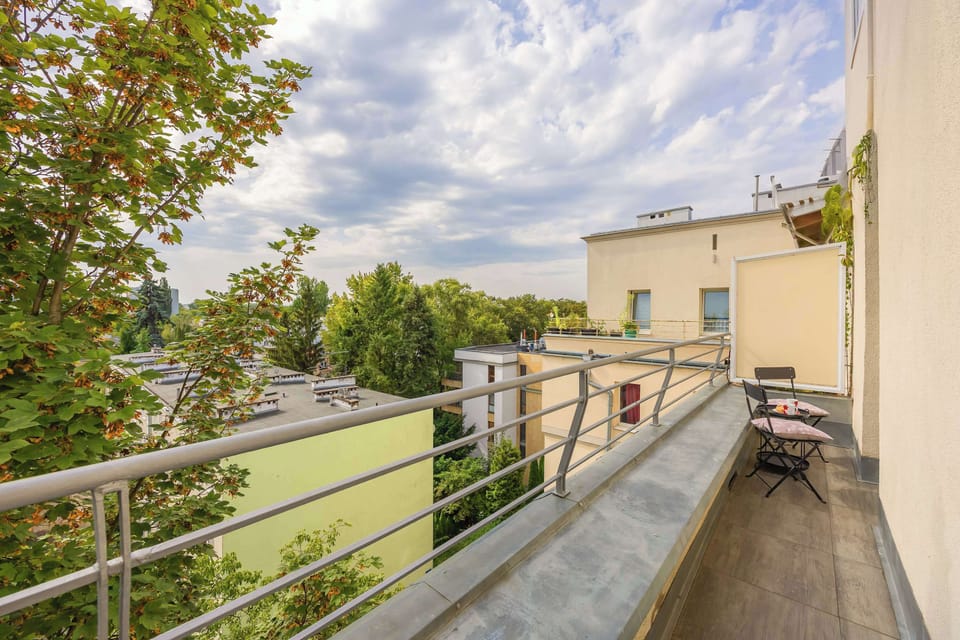 The sunny balcony overlooking greenery offers a chance to relax outdoors at any time of the day.