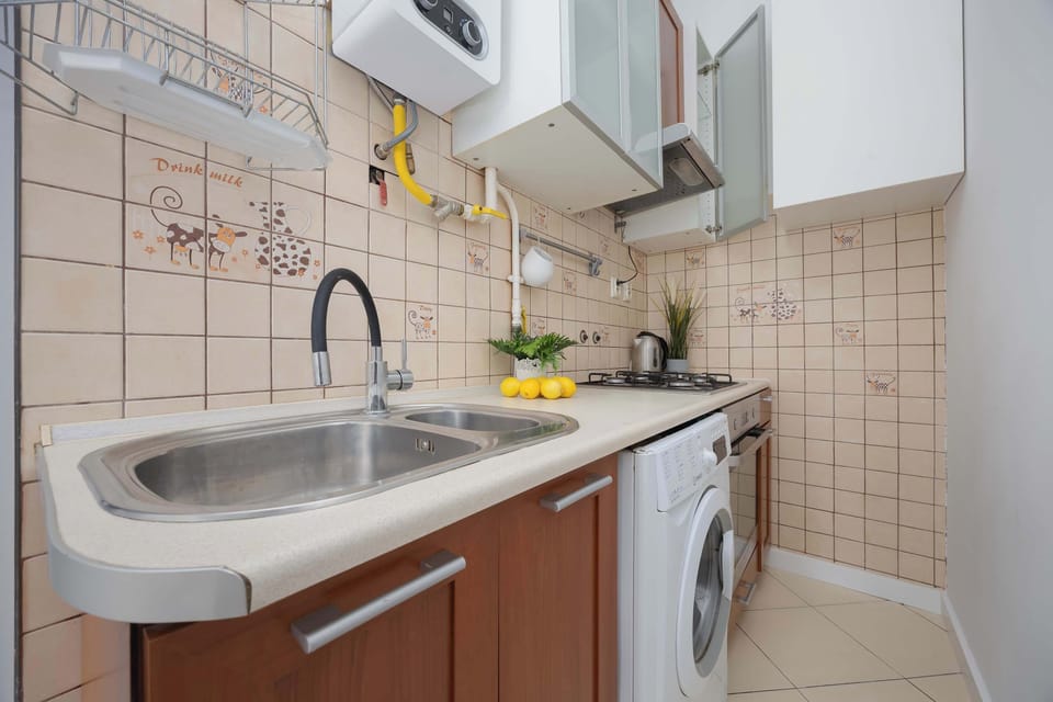 The bright kitchen with a practical countertop and modern appliances makes everyday meal preparation easy.