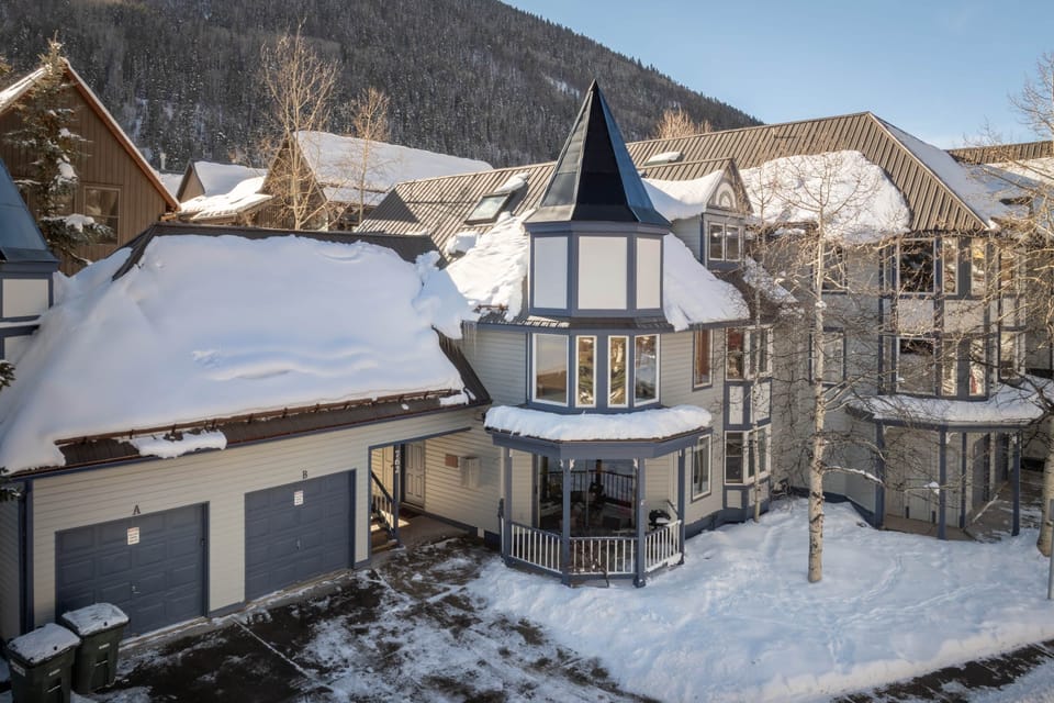 Winter exterior at Smuggler condos - the condo features a driveway parking spot