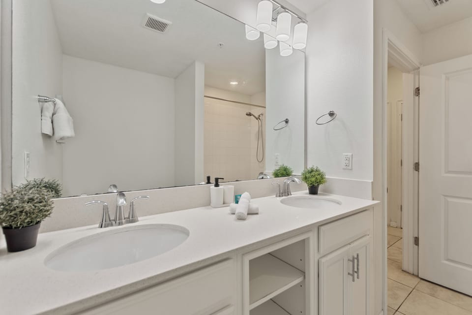 Modern bathroom with single vanity and frameless shower – Shine Villas | Sunset Retreat, Storey Lake Resort, Orlando