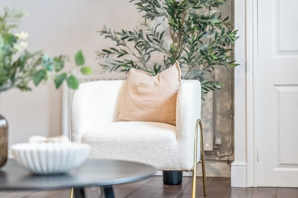 Spacious comfort awaits! With sofas, a cozy fireplace, and plenty of room to gather, this living room is perfect for movie nights, relaxed hangouts, or simply unwinding in style.