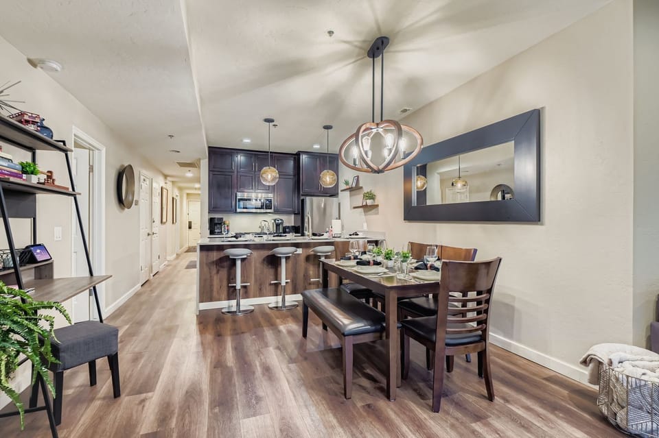 Enjoy our modern kitchen with a breakfast bar and a stylish dining area with unique lighting. Perfect for home-cooked meals during your stay.