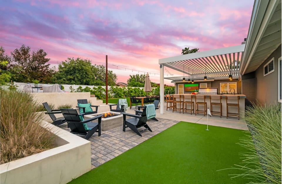 Gather around the custom built gas fire pit with 6 Adirondack chairs. 