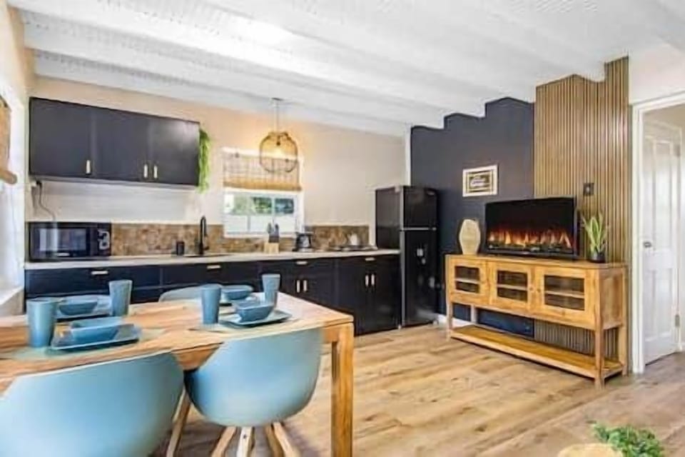 A modern kitchen with dining area