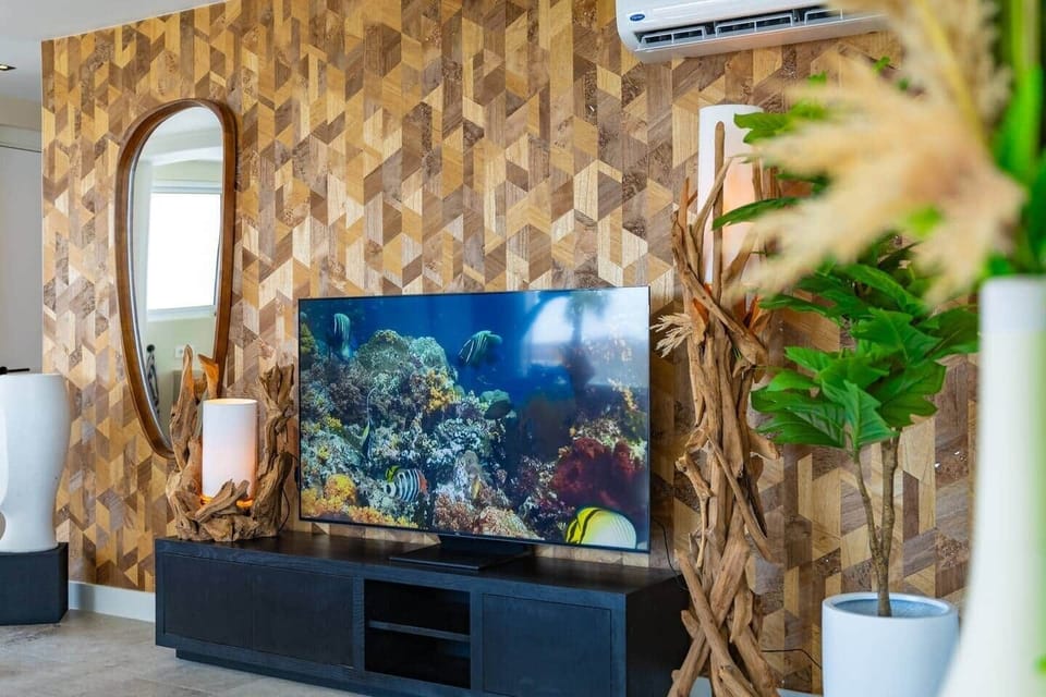 Unwind & Enjoy ️ – After a day at the beach, kick back and catch your favorite shows on this stunning 70-inch Smart TV—luxury and leisure at its finest!