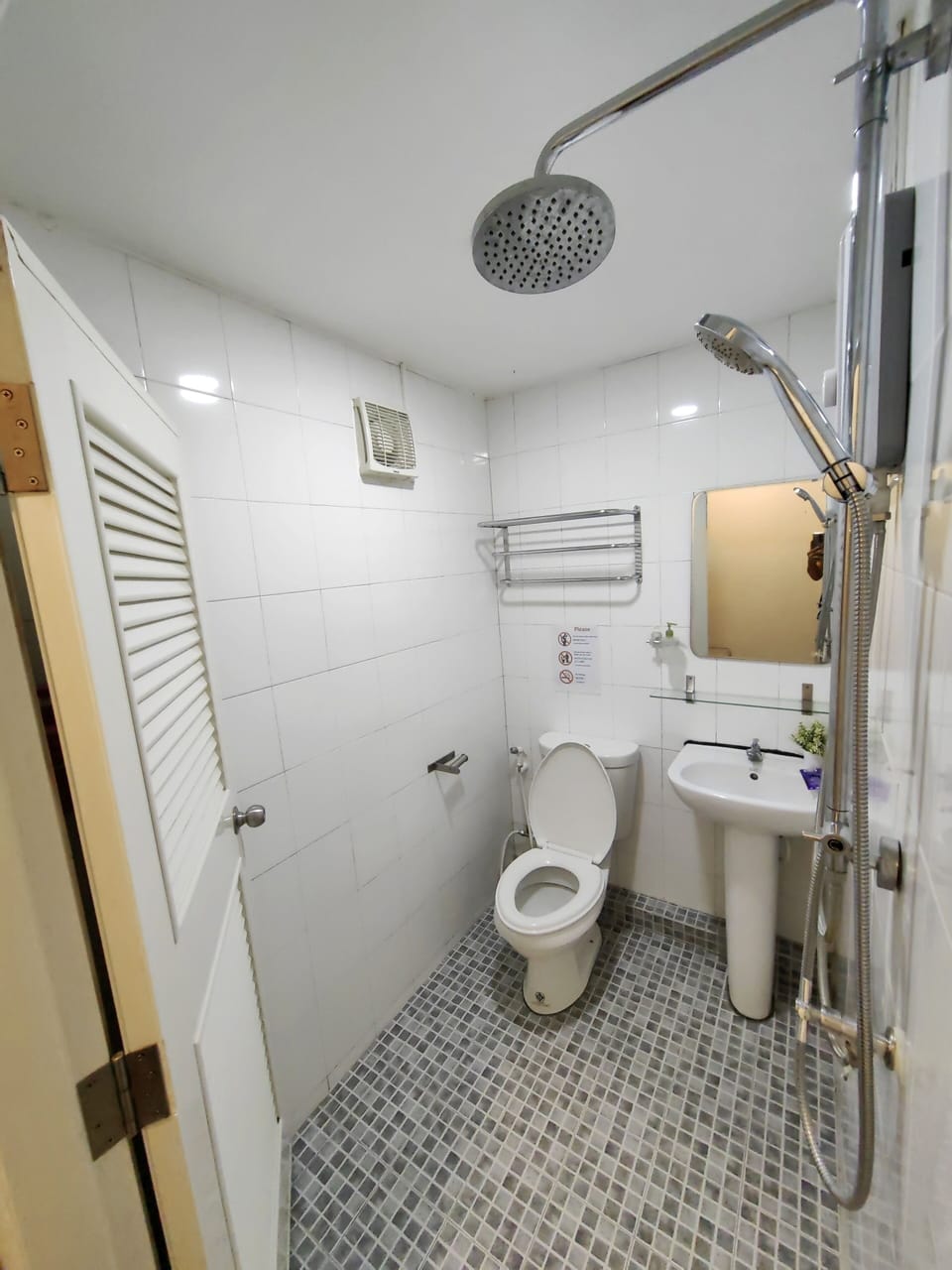 Shower, hair dryer, slippers, towels