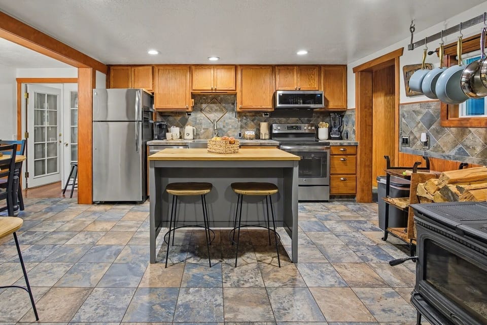 A kitchen worth cooking in — island, full appliances, good knives.