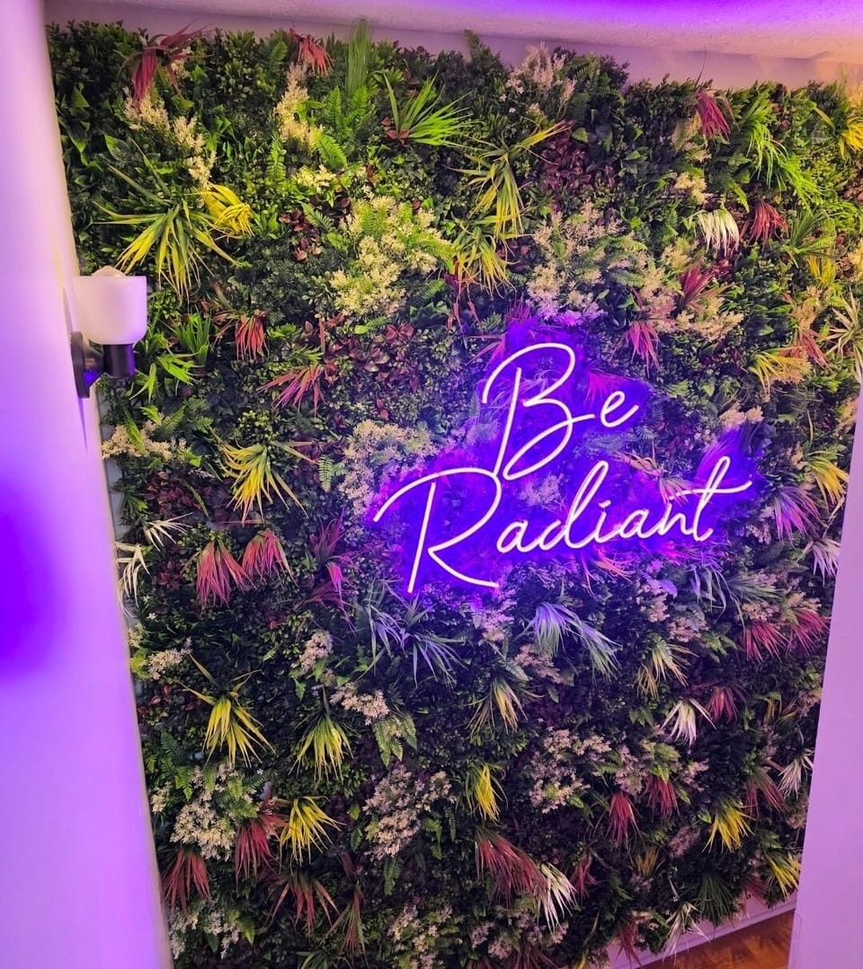 Be Radiant' — a daily reminder surrounded by lush greenery and glowing good vibes.