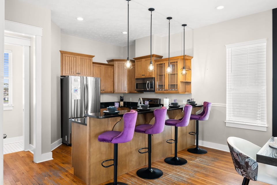 Sleek countertops, stainless appliances, and stylish bar seating — cook and gather all in one spot.