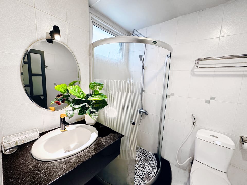 Shower, slippers, bidet, towels