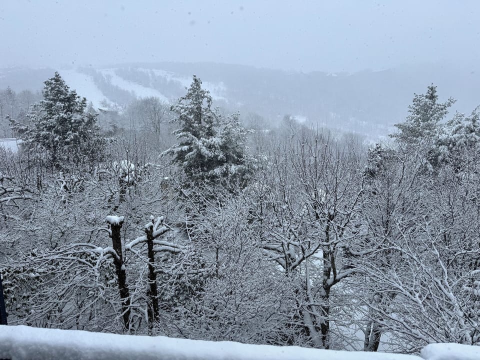 Watch the skiers from the deck. 