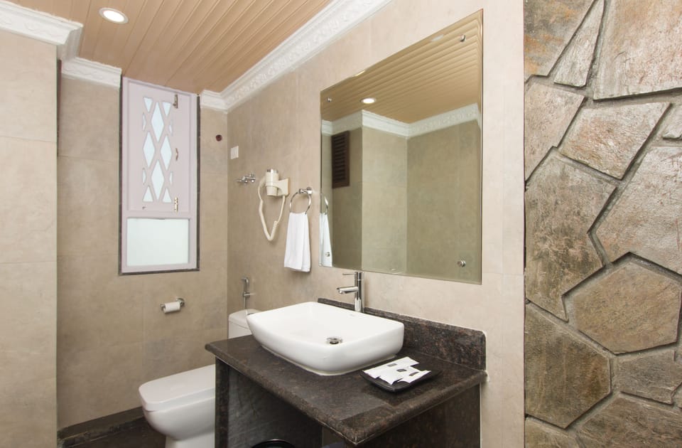 Shower, free toiletries, hair dryer, slippers