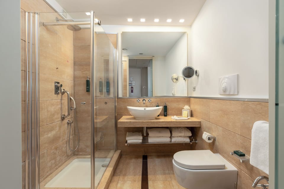 Shower, free toiletries, hair dryer, slippers