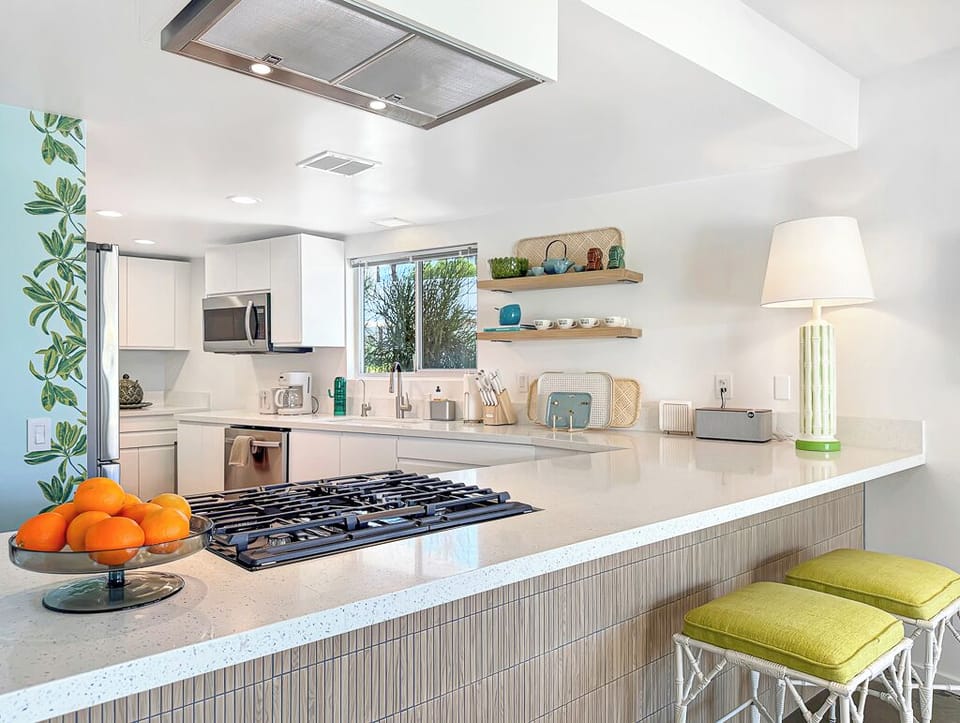 Cook at the gas stove while your friends sit at the bar.  New appliances!