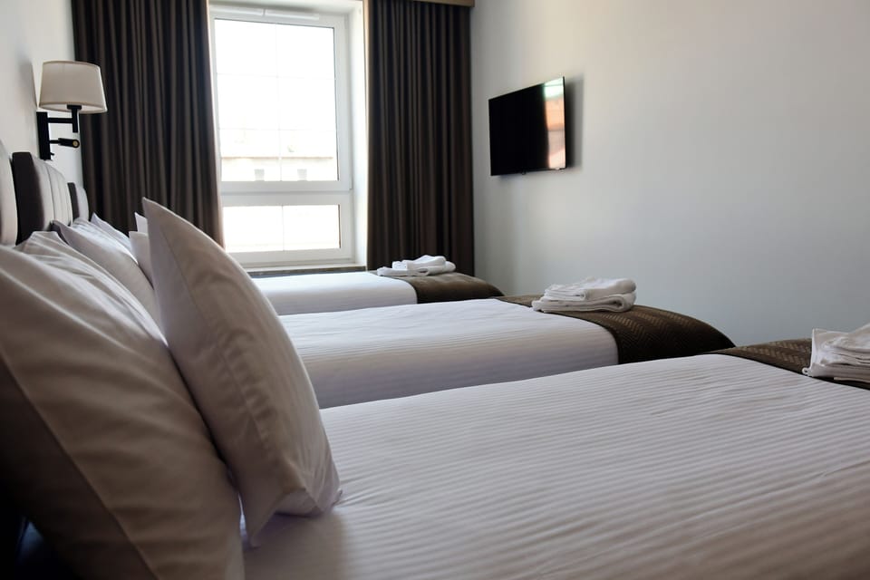 Classic Triple Room, Garden View | Desk, laptop workspace, soundproofing, free WiFi