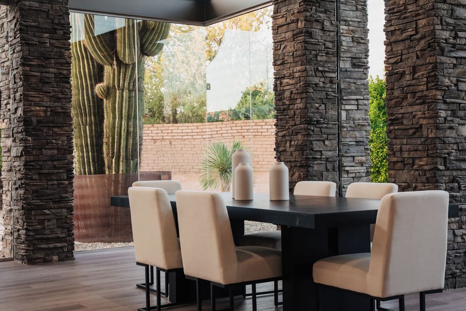 Modern desert dining with timeless textures—where every seat has a view.