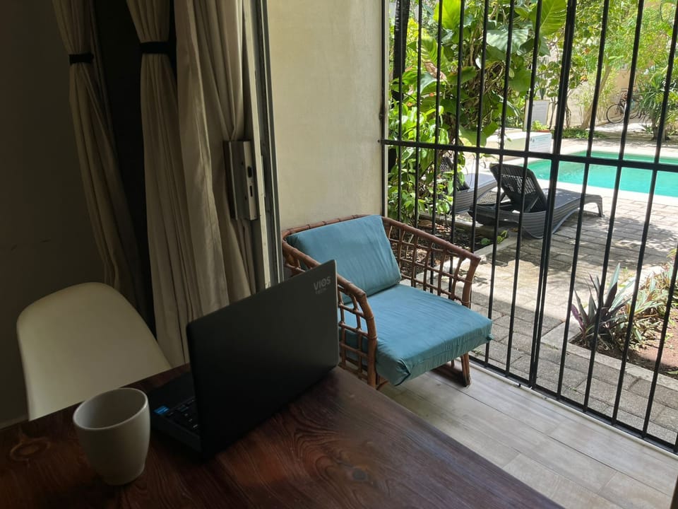 Standard Studio, Balcony, Pool View | Living area